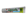 The inner ointment tube of United Neemol Ointment outside of its box packaging.