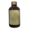 Active Ayurvedic ingredients and botanical composition list on the side panel of the SNA Amrutavrishapatolaadi Kashayam box packaging.