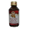 Inner glass container bottle of SNA Varuni Tailam, an Ayurvedic medicated oil for skin care and inflammation.